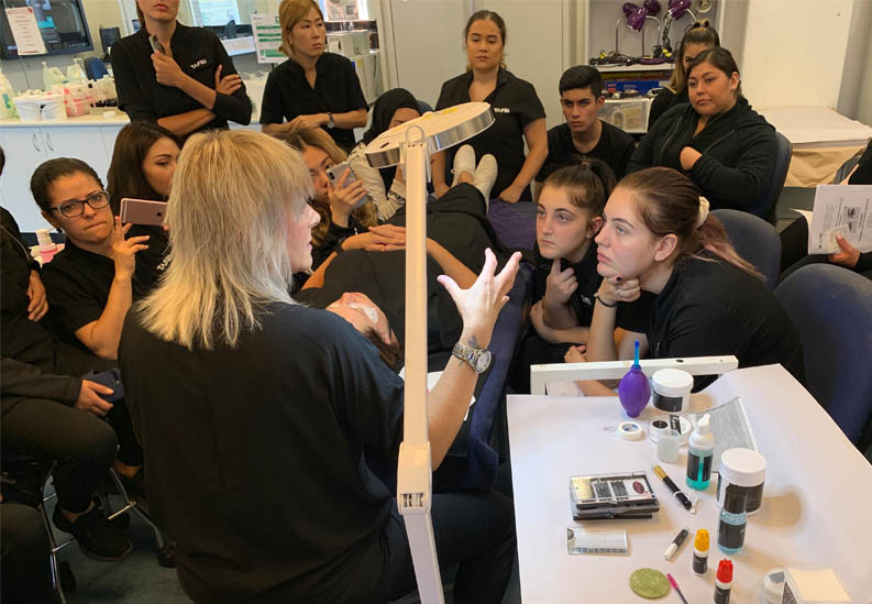 Eyelash Trainer Giving Tips of the Trade to Beauty Students
